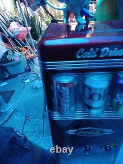 A Retro Series Coca-Cola Cold Drinks Vending Machine Holds 18