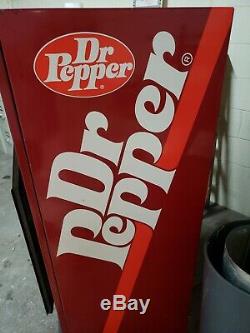 Antique dr pepper machine. Coin mech and fridge works perfectly