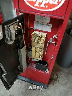Antique dr pepper machine. Coin mech and fridge works perfectly