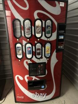 Coca-Cola branded Modern vending machine. Cans, Bottles Or Snacks