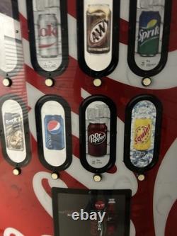 Coca-Cola branded Modern vending machine. Cans, Bottles Or Snacks