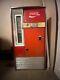 Large Red 1962 antique coke machine. Still works, comes with key