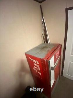 Large Red 1962 antique coke machine. Still works, comes with key