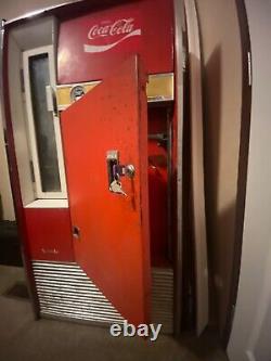 Large Red 1962 antique coke machine. Still works, comes with key