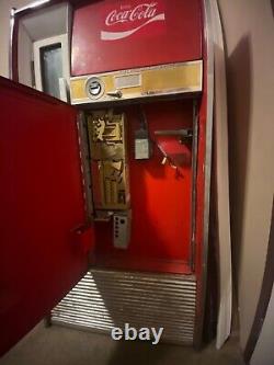 Large Red 1962 antique coke machine. Still works, comes with key