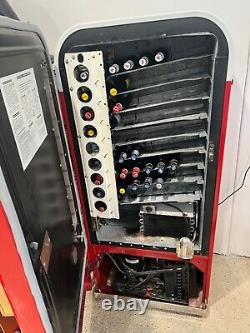 Vintage coke machine restored working condition